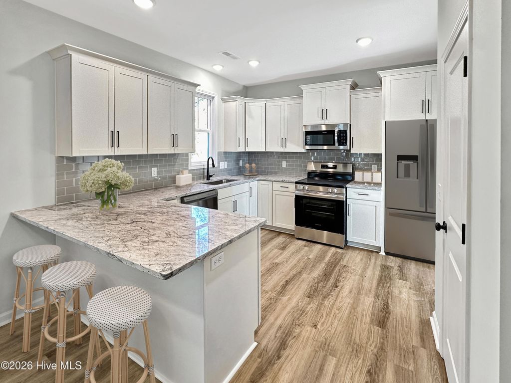 Photo of 3034 River Hills Drive SW, Shallotte, NC 28470 (MLS # 100489344)