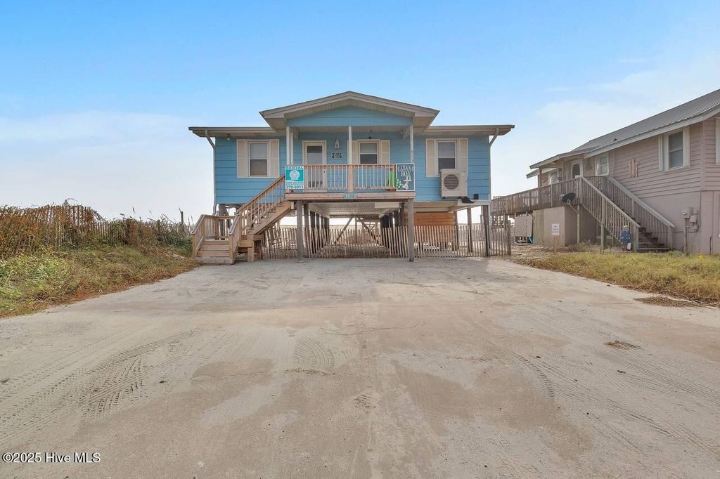 Photo of 1011 W Beach Drive, Oak Island, NC 28465 (MLS # 100550375)