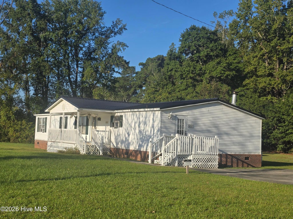Photo of 416 Grimes Singletary Road, Tar Heel, NC 28392 (MLS # 100606532)