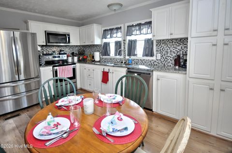 Tiny photo for 166 NE 5th Street, Oak Island, NC 28465 (MLS # 100550740)