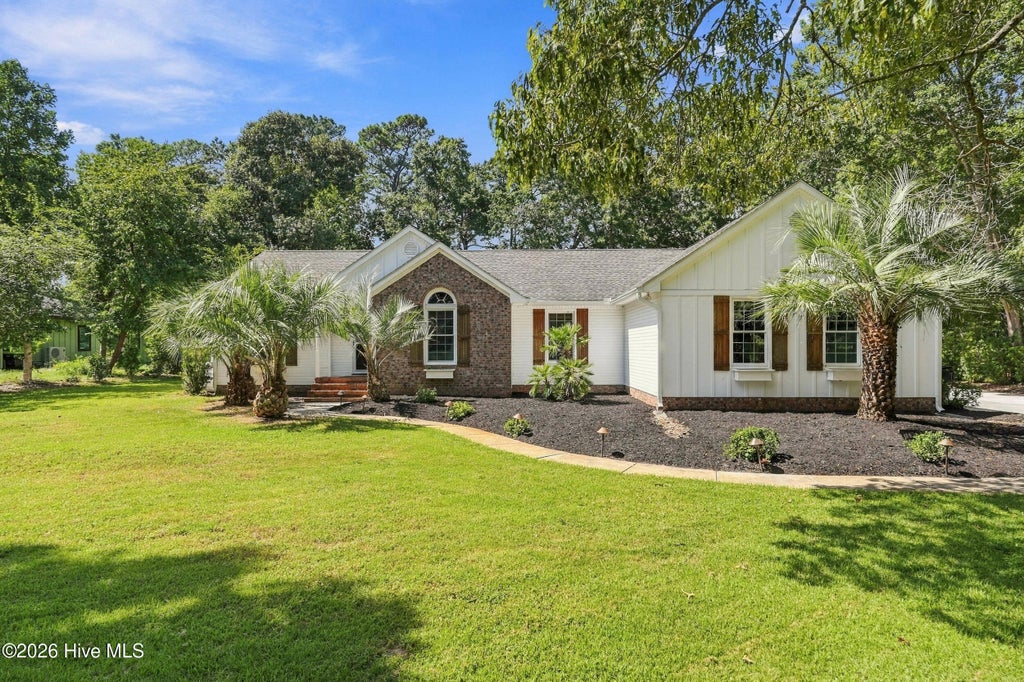 Photo of 613 Ravenswood Road, Hampstead, NC 28443 (MLS # 100604245)