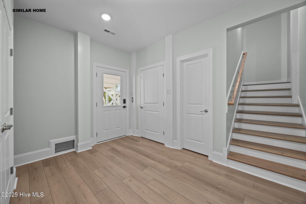 Photo of 1202 N Topsail Drive, Surf City, NC 28445 (MLS # 100551707)