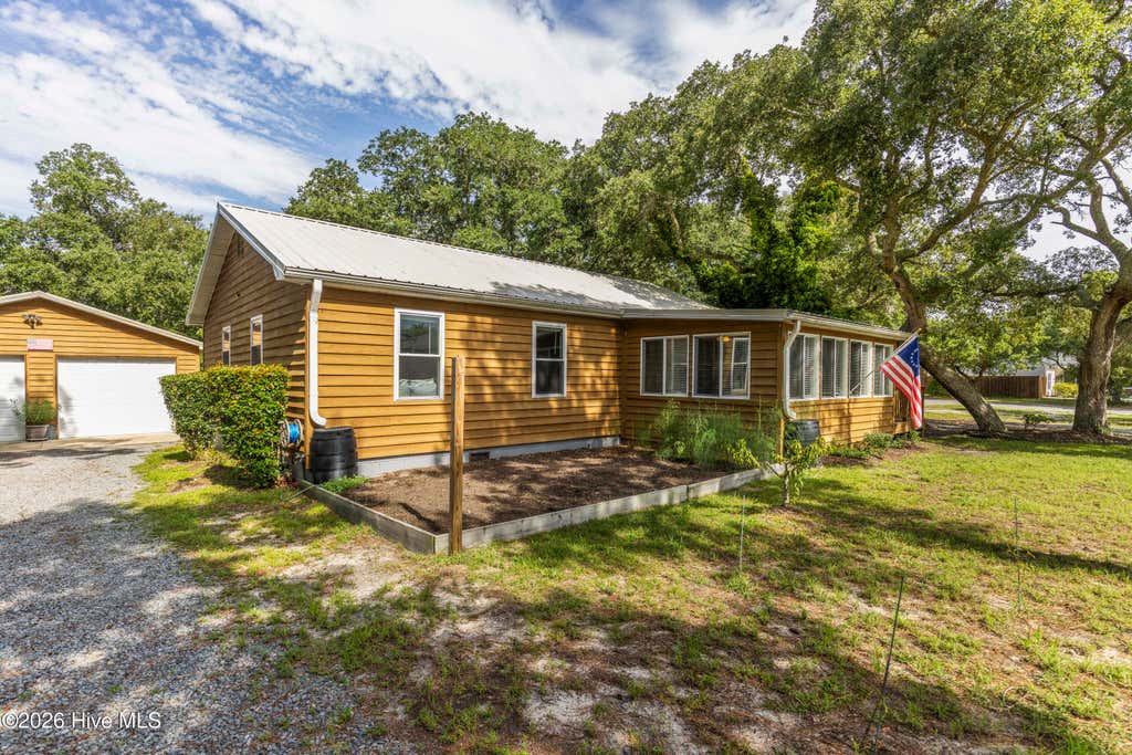 Photo of 105 NW 7th Street, Oak Island, NC 28465 (MLS # 100594310)