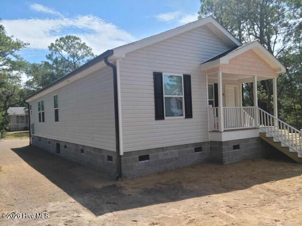 Photo of 113 Pecan Avenue, Lake Waccamaw, NC 28450 (MLS # 100573832)