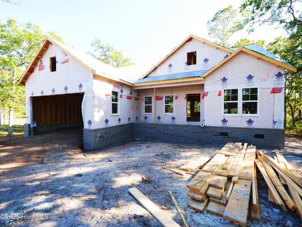 Photo of 3049 River Hills Drive SW, Shallotte, NC 28470 (MLS # 100483564)