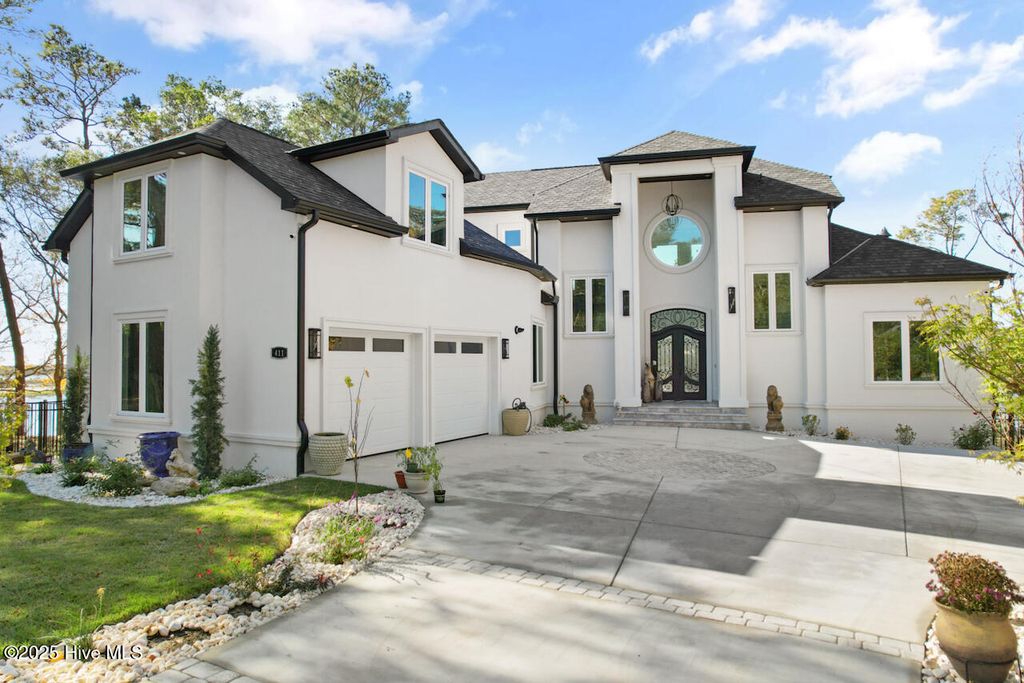 Photo of 411 Lake Shore Drive, Sunset Beach, NC 28468 (MLS # 100531271)