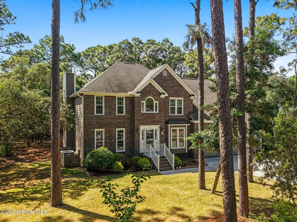 Photo of 504 Periwinkle Way, Caswell Beach, NC 28465 (MLS # 100577309)