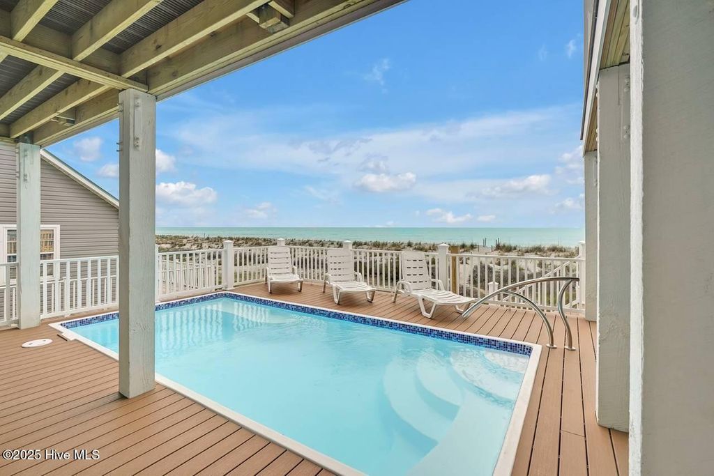 Photo of 4005 E Beach Drive, Oak Island, NC 28465 (MLS # 100541400)