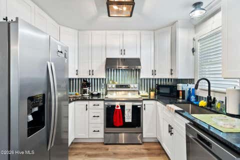 Tiny photo for 302 NE 59th Street, Oak Island, NC 28465 (MLS # 100584826)