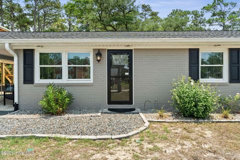Tiny photo for 302 NE 59th Street, Oak Island, NC 28465 (MLS # 100584826)