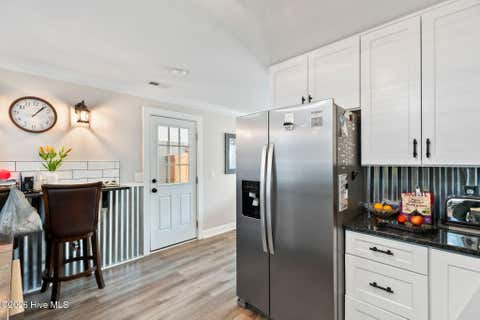 Tiny photo for 302 NE 59th Street, Oak Island, NC 28465 (MLS # 100584826)