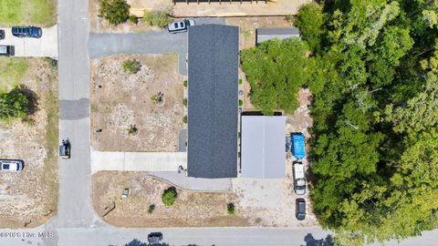 Tiny photo for 302 NE 59th Street, Oak Island, NC 28465 (MLS # 100584826)