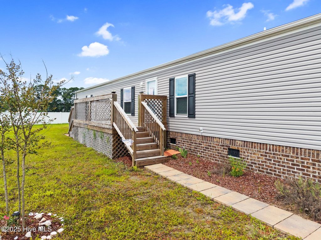 Photo of 930 Pineclair Drive SW, Calabash, NC 28467 (MLS # 100526745)