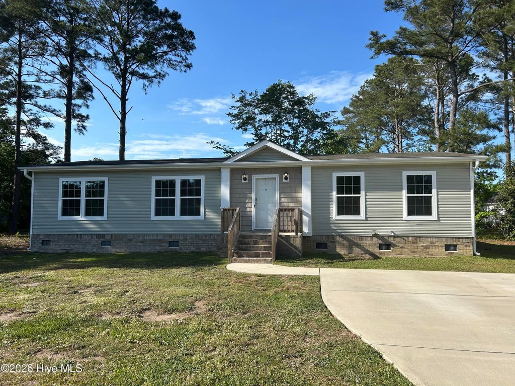 Photo of 857 Nicholas Drive SW, Carolina Shores, NC 28467 (MLS # 100559246)