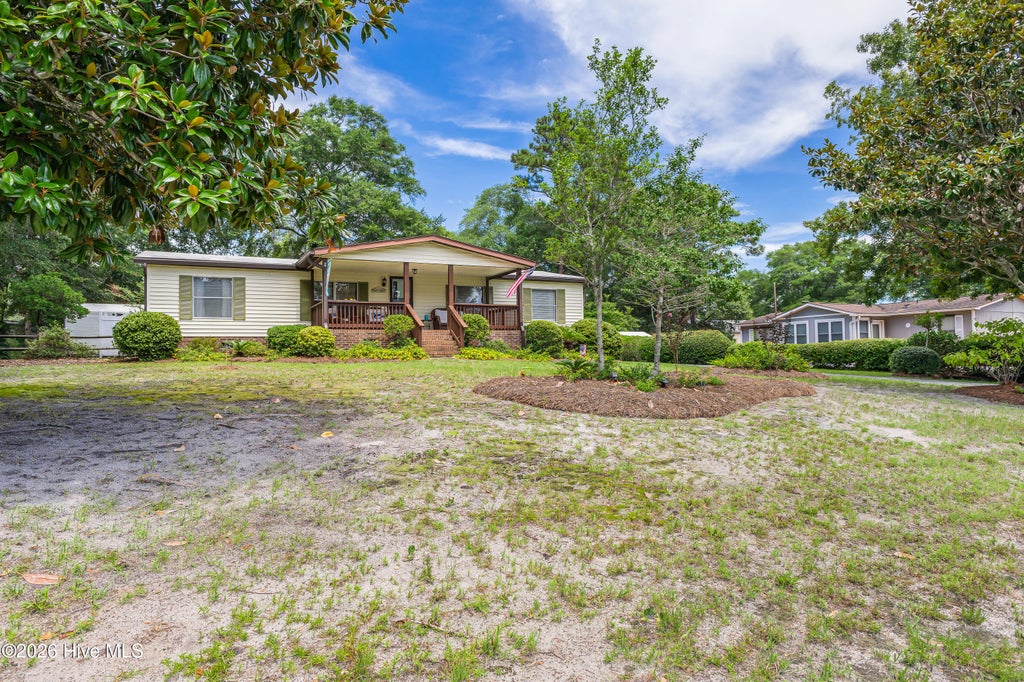 Photo of 609 Magnolia Drive, Sunset Beach, NC 28468 (MLS # 100594268)