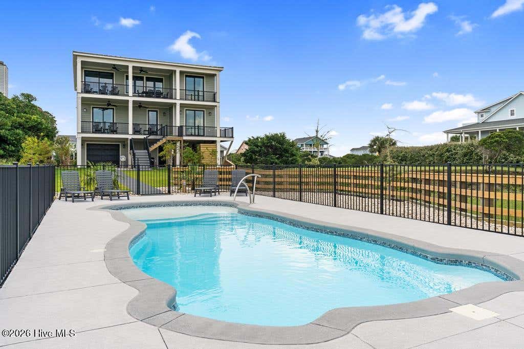 Photo of 6620 Kings Lynn Drive, Oak Island, NC 28465 (MLS # 100598262)