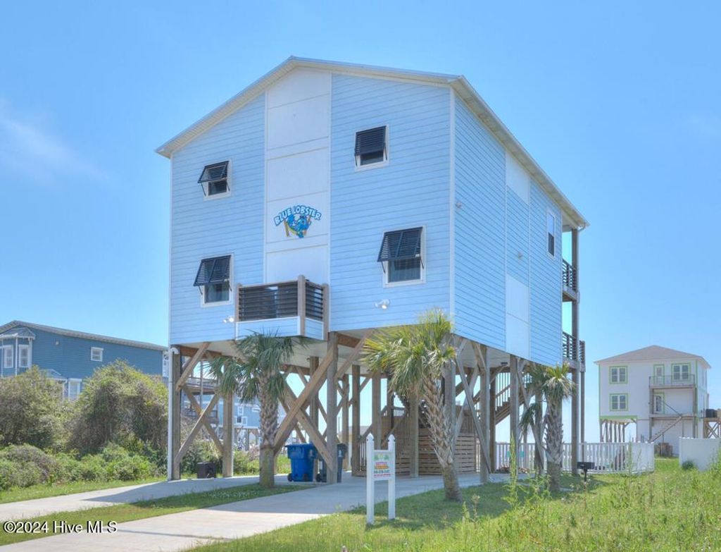 Photo of 5207 E Pelican Drive, Oak Island, NC 28465 (MLS # 100570812)