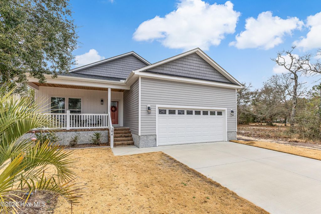 Photo of 304 E Oak Island Drive, Oak Island, NC 28465 (MLS # 100554895)
