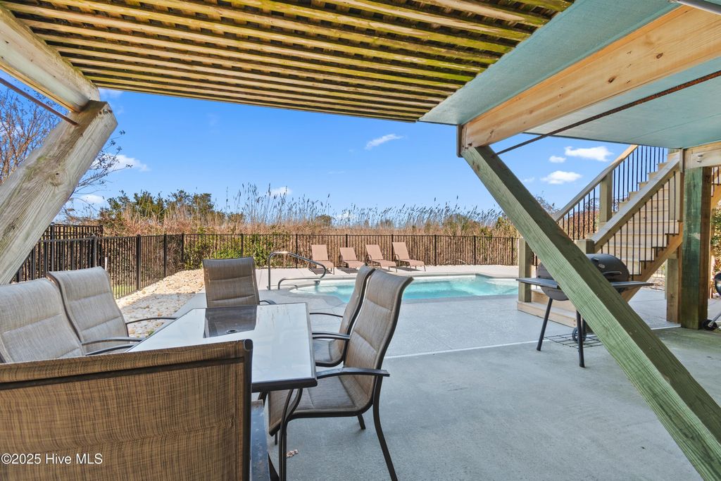 Photo of 108 Caswell Beach Road, Oak Island, NC 28465 (MLS # 100494024)