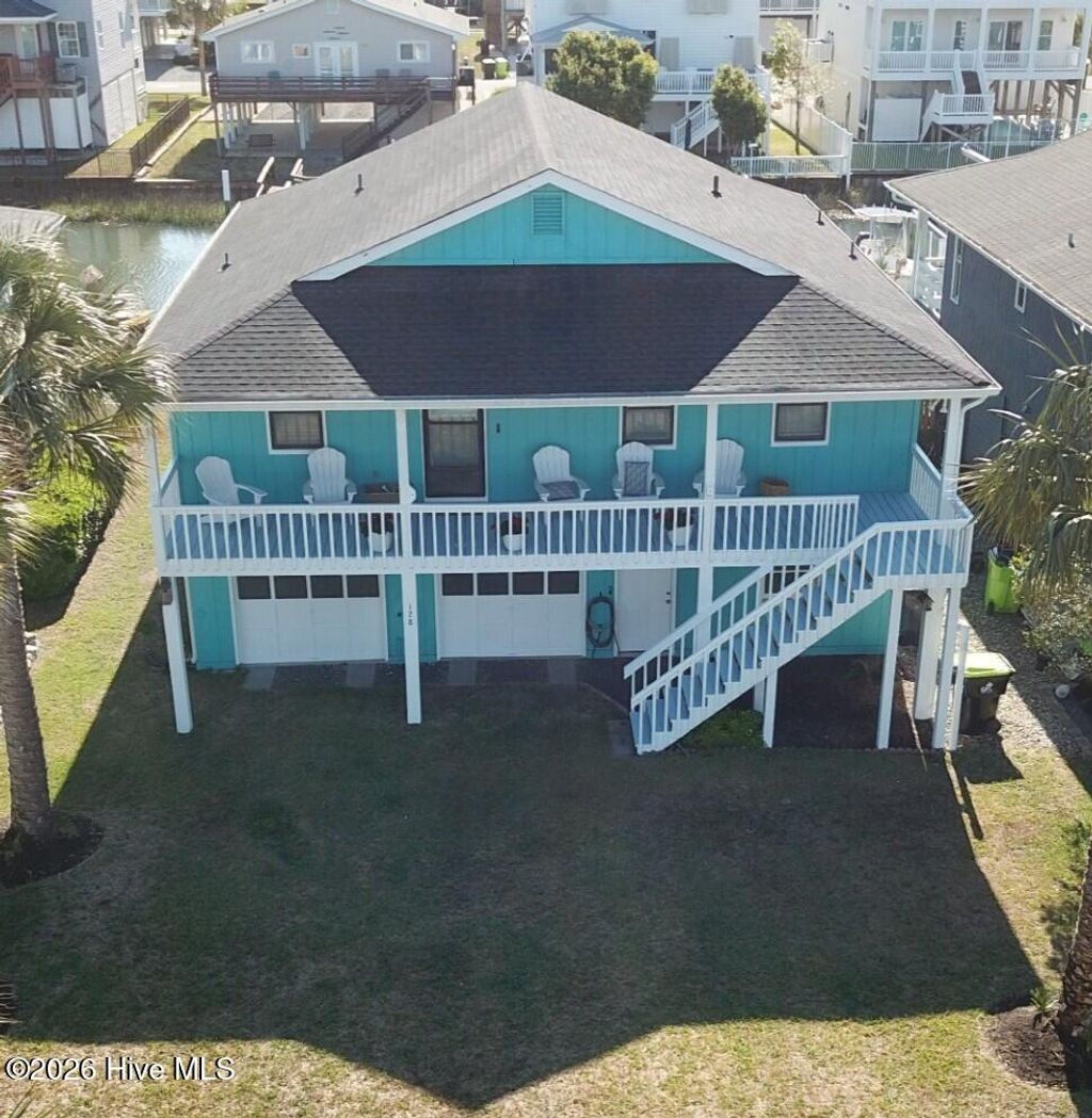 Photo of 128 Tarpon Drive, Holden Beach, NC 28462 (MLS # 100571769)