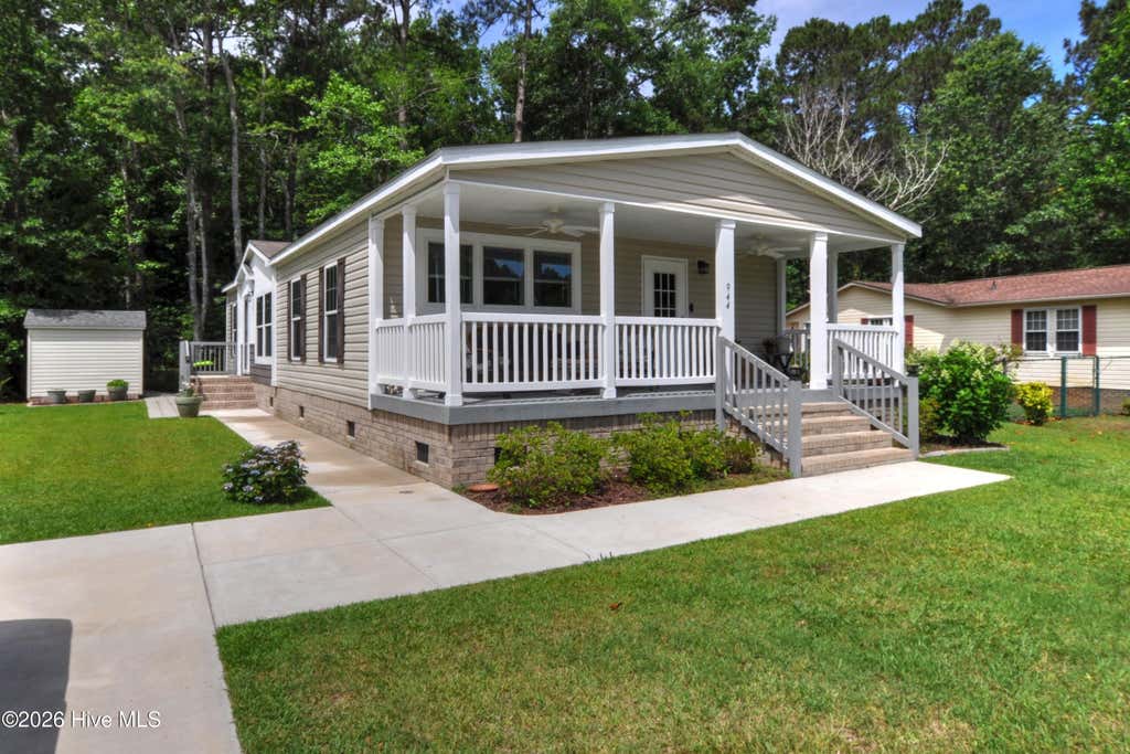Photo of 944 Palmer Drive, Carolina Shores, NC 28467 (MLS # 100554917)