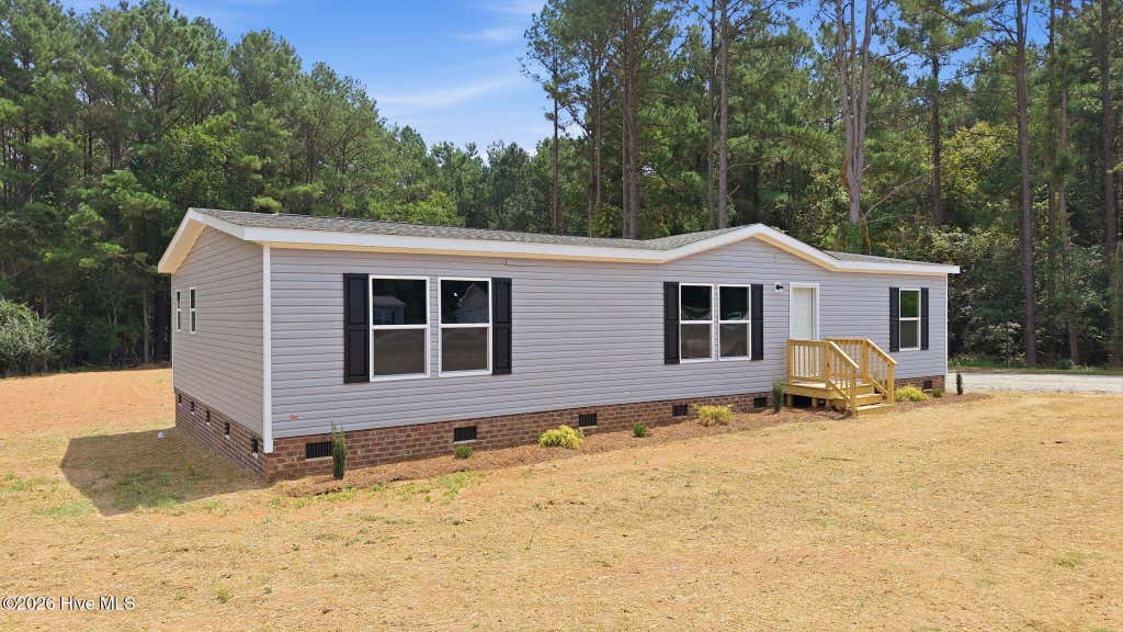 Photo of 9757 Fire Tower Farm Road, Whitakers, NC 27891 (MLS # 100597987)