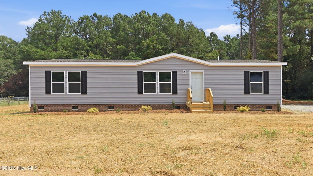 Photo of 9757 Fire Tower Farm Road, Whitakers, NC 27891 (MLS # 100597987)