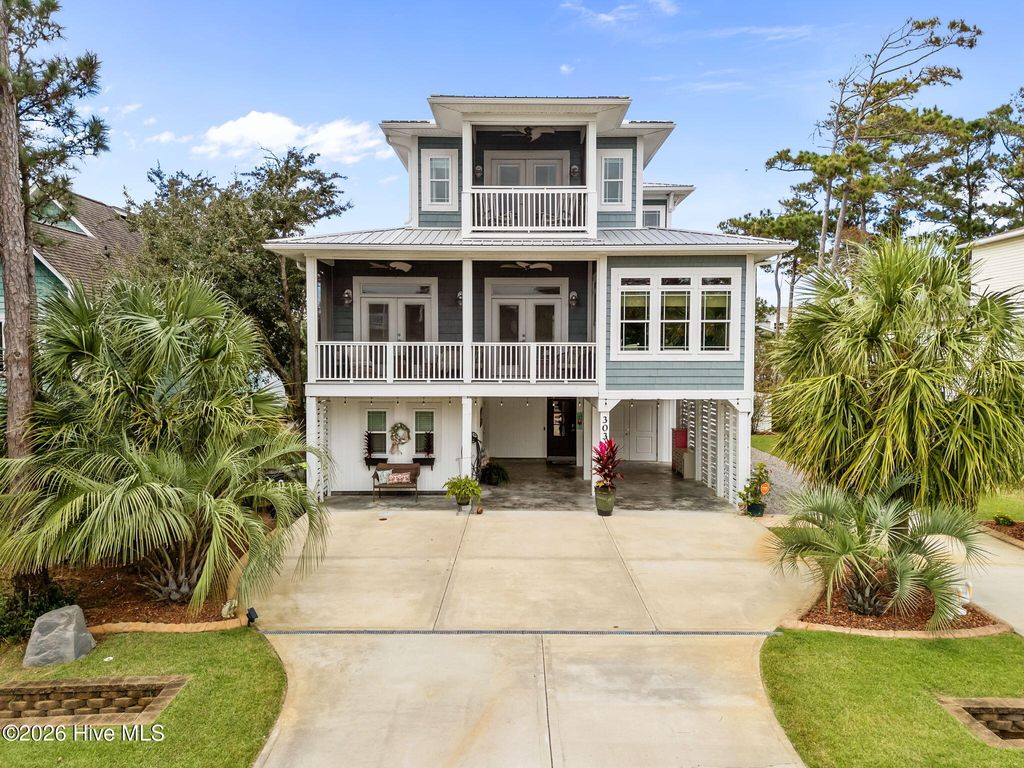 Photo of 303 Mcglamery Street, Oak Island, NC 28465 (MLS # 100557179)