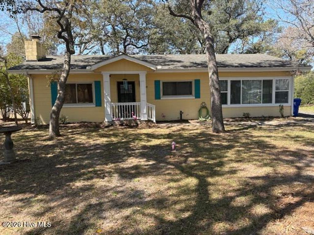 Photo of 313 Mercer Street, Oak Island, NC 28465 (MLS # 100563343)