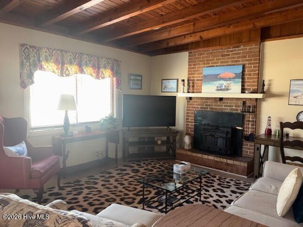 Photo of 313 Mercer Street, Oak Island, NC 28465 (MLS # 100563343)