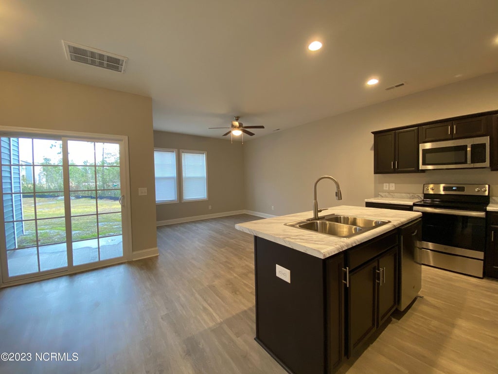 Photo of 505 Stone Crab Lane, Sneads Ferry, NC 28460 (MLS # 100605426)