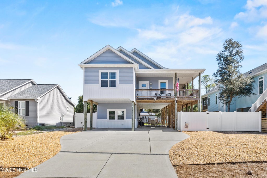 Photo of 128 NE 8th Street, Oak Island, NC 28465 (MLS # 100610459)
