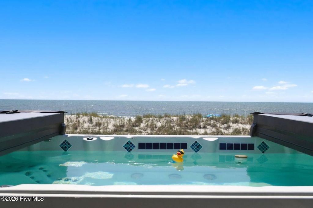 Photo of 4327 E Beach Drive, Oak Island, NC 28465 (MLS # 100576388)