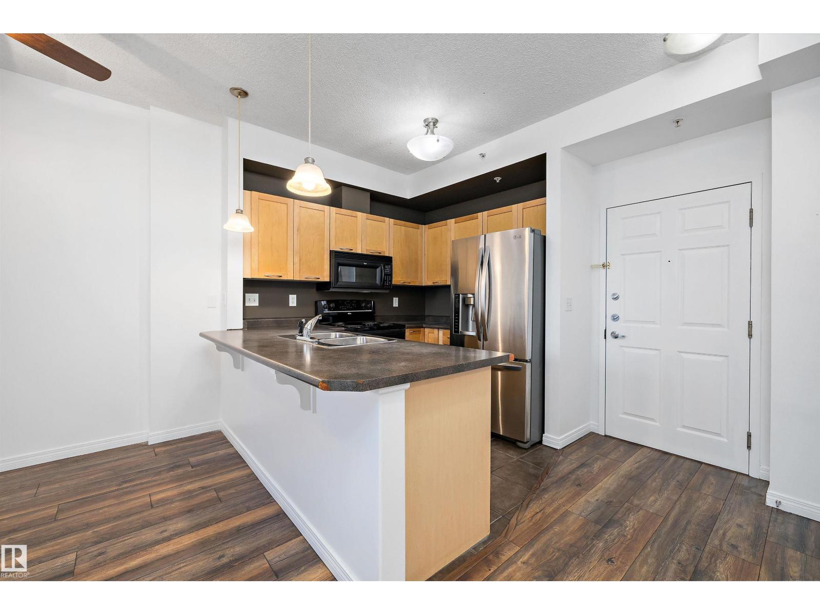 #1-208 4245 139 AV NW