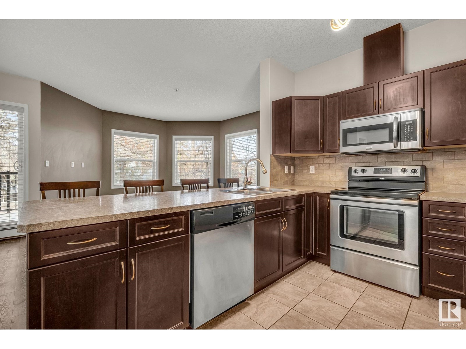 #210 9927 79 AV NW NW