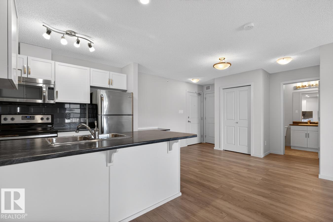 #426 390 WINDERMERE RD NW