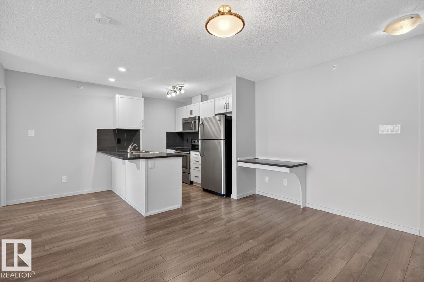 #426 390 WINDERMERE RD NW