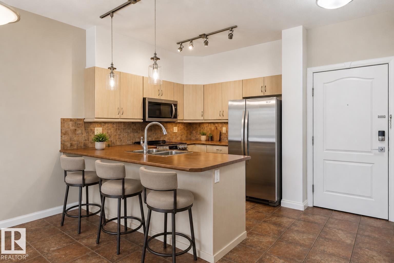 #310 1406 HODGSON WY NW