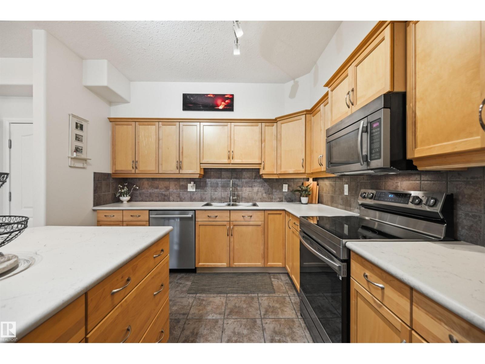 #338 1406 HODGSON WY NW