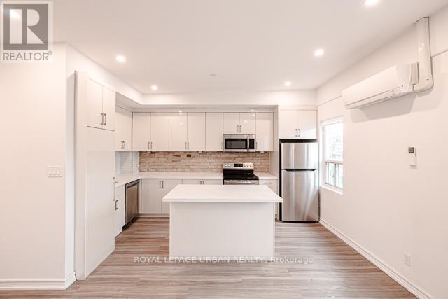 3 - 991 QUEEN STREET E