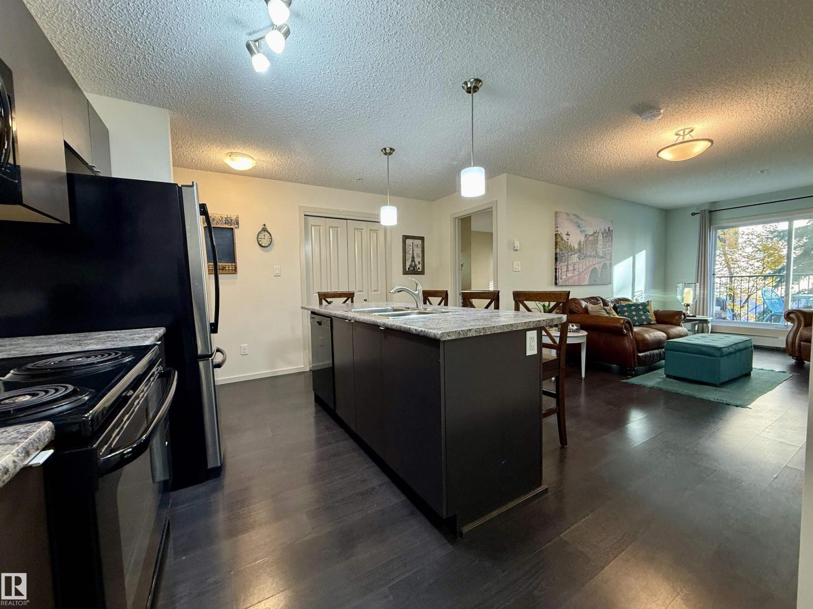 #202 340 WINDERMERE RD NW