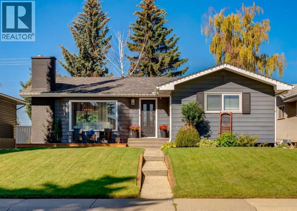 Photo 1 of 50 — 425 Woodland Crescent SE, Calgary, AB T2J1J7