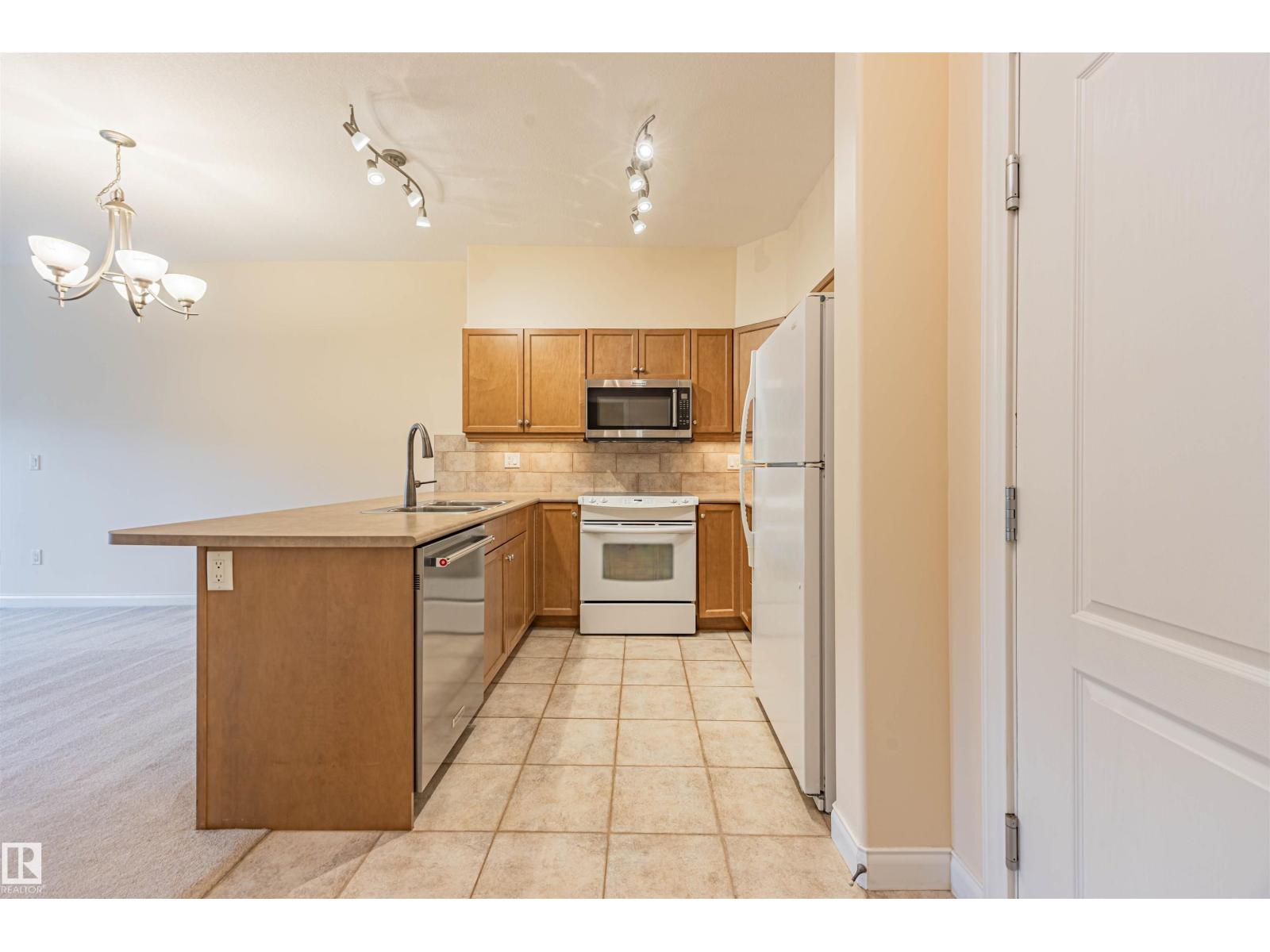 #110 1406 HODGSON WY NW