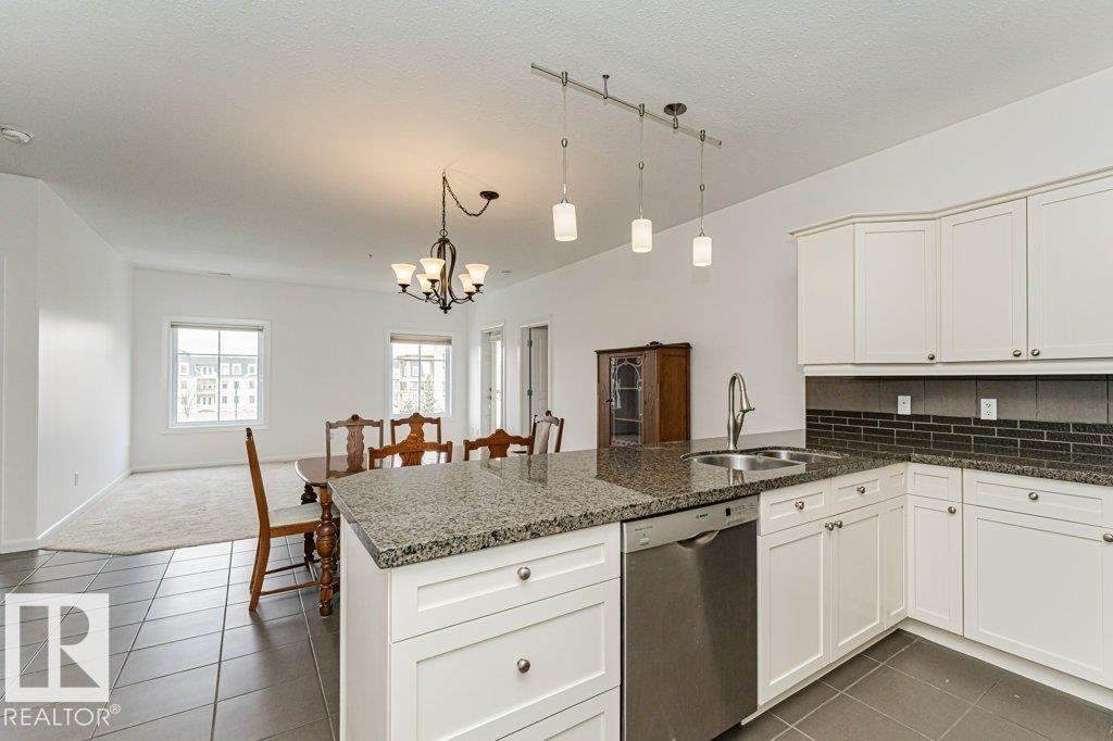 #302 160 MAGRATH RD NW