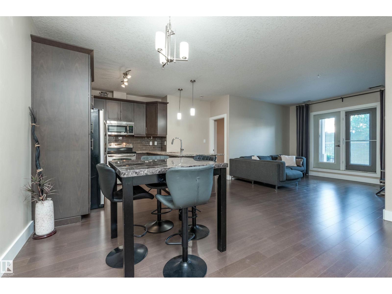 #140 6079 MAYNARD WY NW