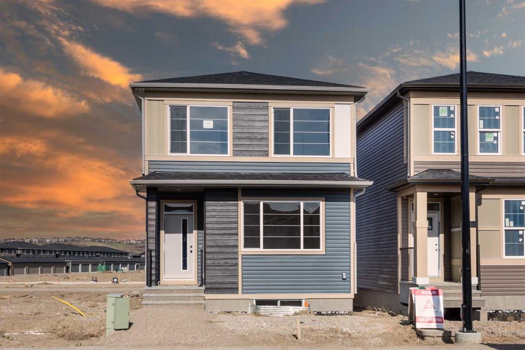 Photo 1 of 34 — 26 WOLF CREEK Rise Southeast, Calgary, AB T2X4Y9