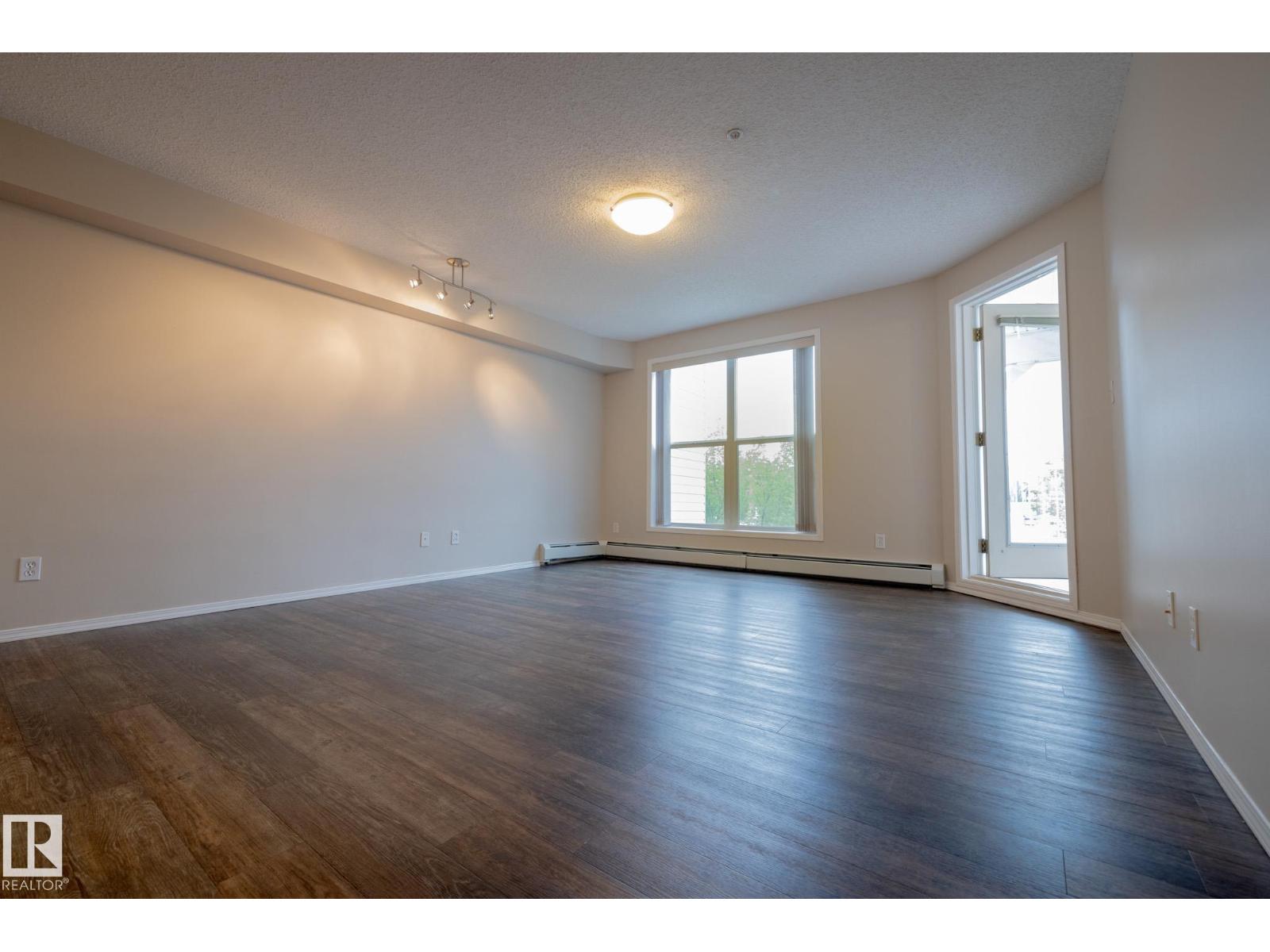 #406 10311 111 ST NW