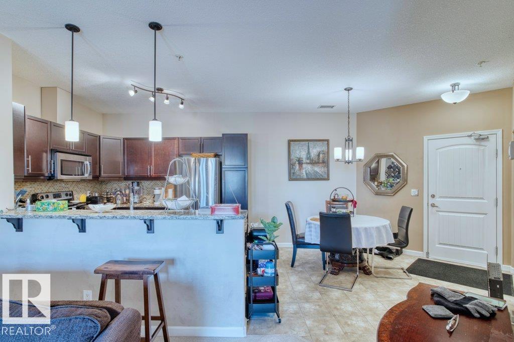 #319 6083 MAYNARD WY NW