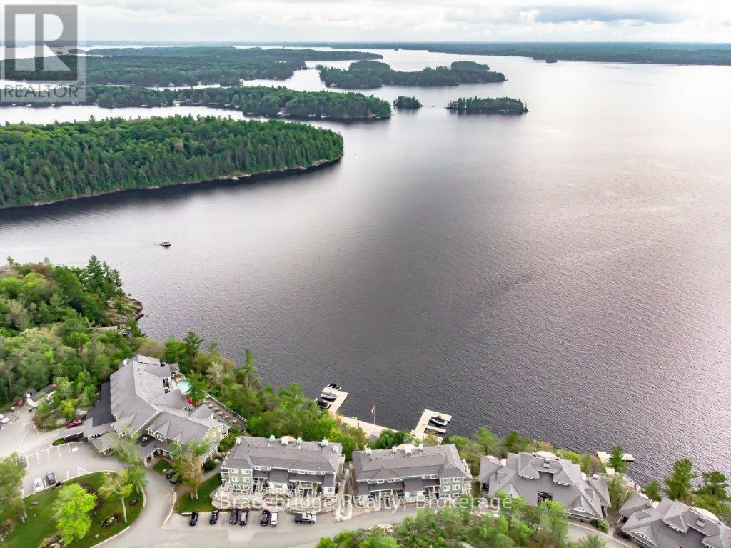 Photo 1 of 29 — B102-C1 - 1869 MUSKOKA RD 118 HIGHWAY W Unit B102-C1, Muskoka Lakes (Monck (Muskoka Lakes)), ON P1L1W8