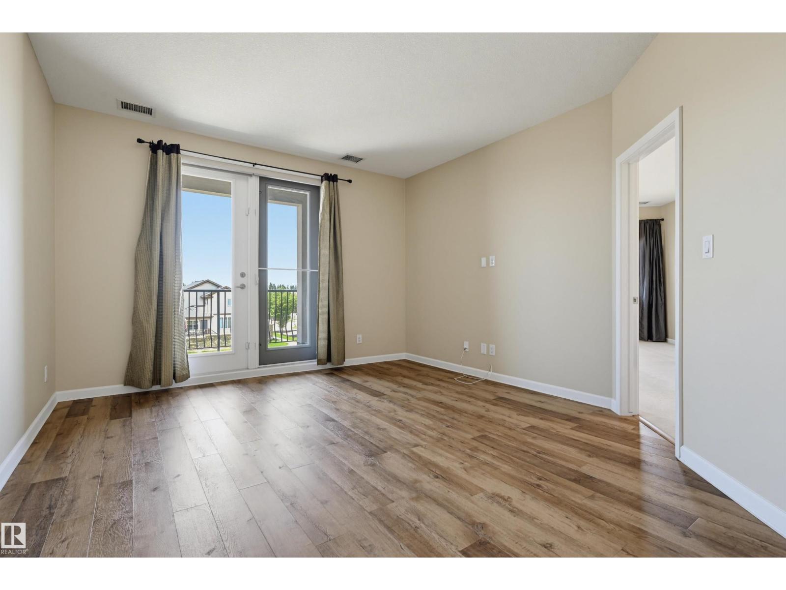 #312 6083 MAYNARD WY NW
